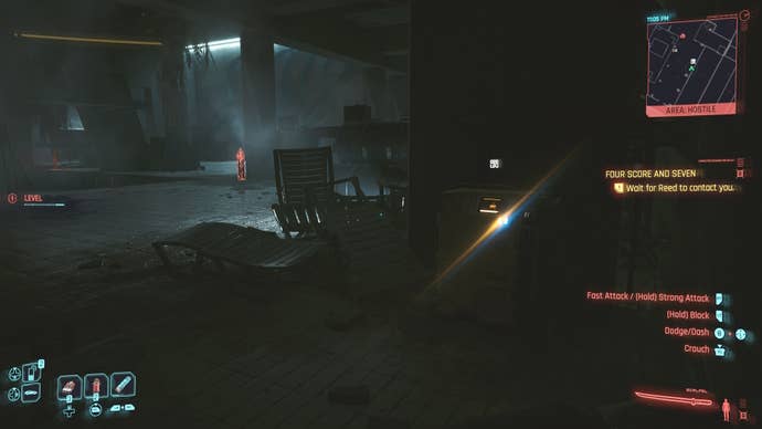 first person view of looking at a yellow restricted data terminal inside a dark building