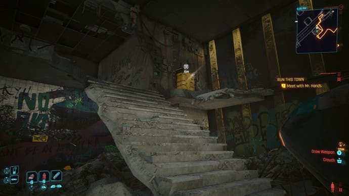 first person view of a yellow restricted data terminal near concrete steps in a dilapidated building