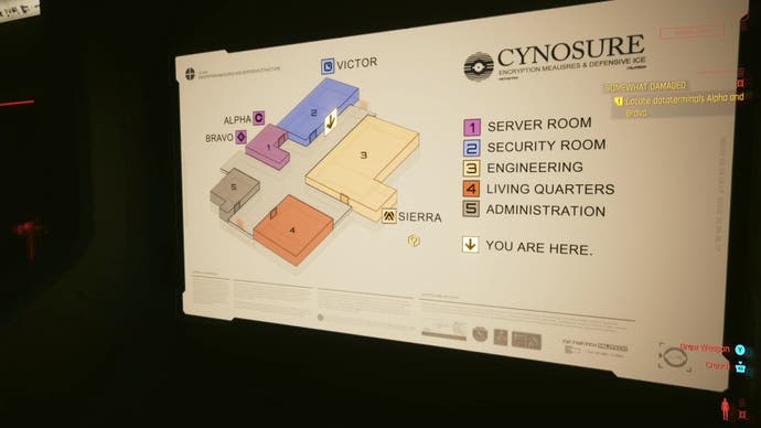 a large wall map showing different sections of the cynosure facility, each assigned a different colour