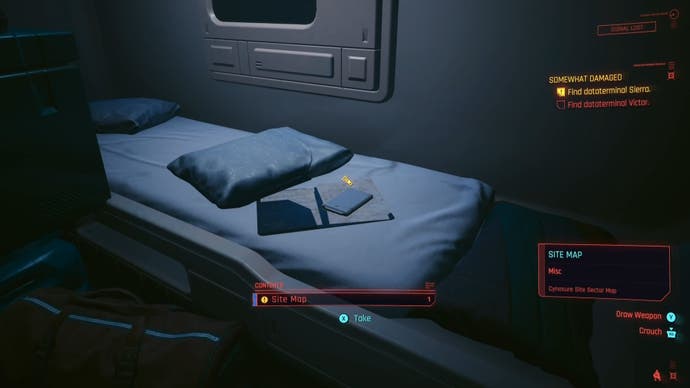 a datashard on a messy single bed with a small yellow hand promot above the datashard
