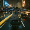 A nighttime driving scene in Cyberpunk 2077: Phantom Liberty, with DLSS 3.5 Ray Reconstruction switched off.