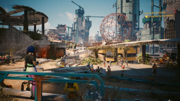Cyberpunk 2077 Phantom Liberty screenshot showing a busy, sunny district in the new area of Dogtown