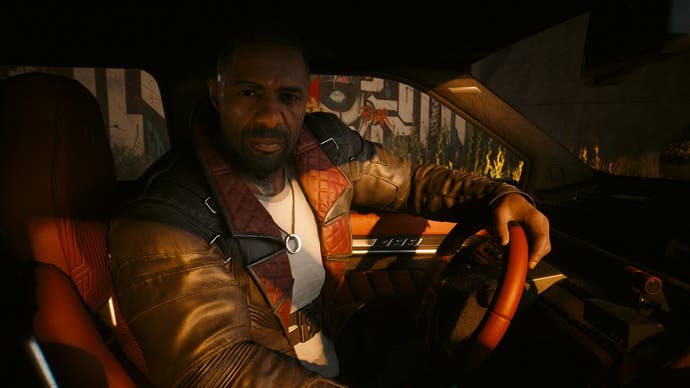 Cyberpunk 2077 Phantom Liberty screenshot in a car talking to Idris Elba’s character Solomon Reed