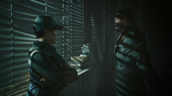 Idris Elba talks to another character in Cyberpunk 2077's Phantom Liberty DLC
