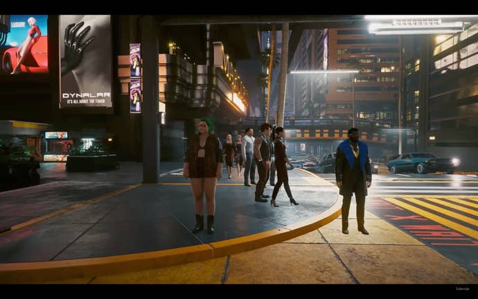NPCs prepare to cross the road in Cyberpunk 2077