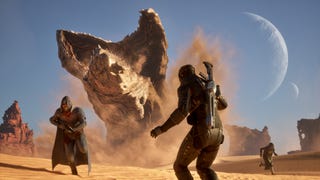 Dune: Awakening in-engine screenshot without UI showing a couple of suited-up characters fleeing a big sandworm bursting out of the desert, with crescent moons in the blue sky behind
