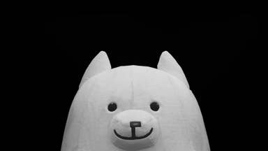 Close up of white dog character from Deltarune on a black background
