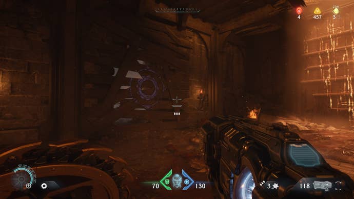 The player aims at a boarded up entryway with a purple shield sigil on it in the Village of Khalim in DOOM: The Dark Ages