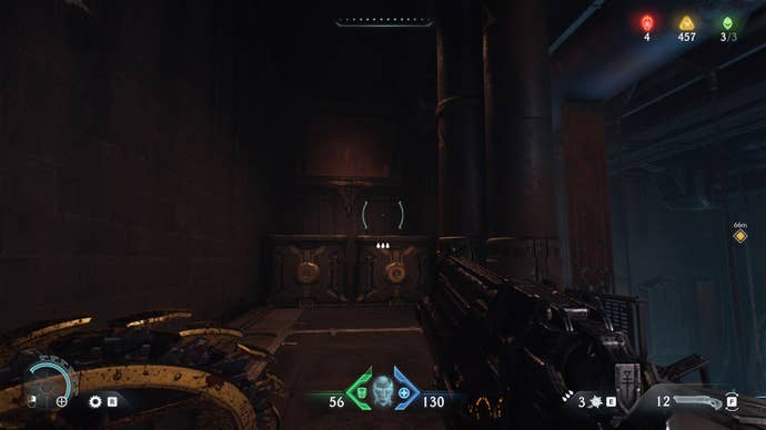 The player looks towards some crates and a vent that lead to a secret location in Hebeth in DOOM: The Dark Ages