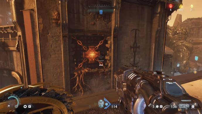The player looks towards some hot metal in Hebeth that the Slayer can throw their Shield Saw at in DOOM: The Dark Ages
