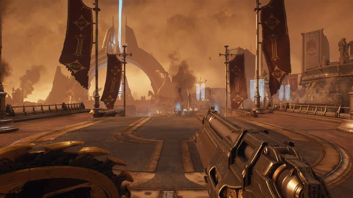 The player spawns at the very beginning of the Hebeth chapter in DOOM: The Dark Ages, and looks out towards some flags and a dusty landscape