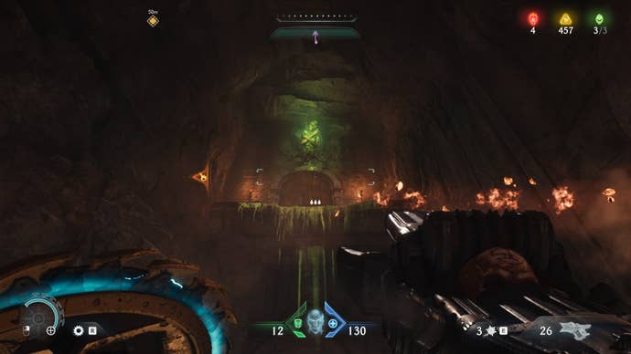 The player aims at a Flesh Node inside of a cave in The Siege Part 1 chapter of DOOM: The Dark Ages