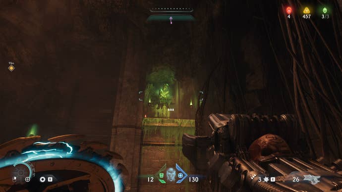 The player aims at a green Flesh Node inside of a cave in The Siege Part 1 chapter of DOOM: The Dark Ages