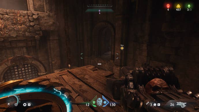The player looks toward a slightly hidden alcove inside of a cave during The Siege Part 1 chapter in DOOM: The Dark Ages
