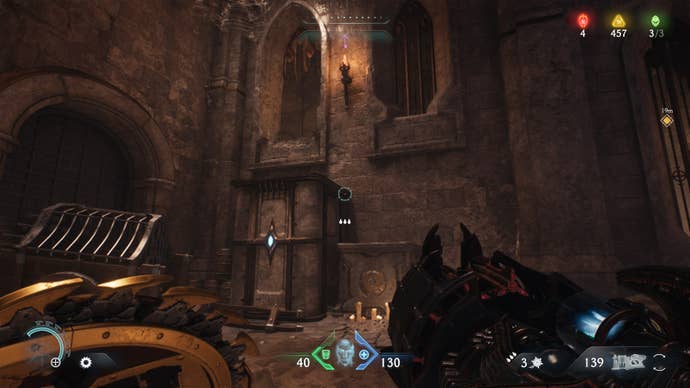 The player looks at two crates that lead to a small open window inside of a cave in The Siege Part 1 chapter of DOOM: The Dark Ages