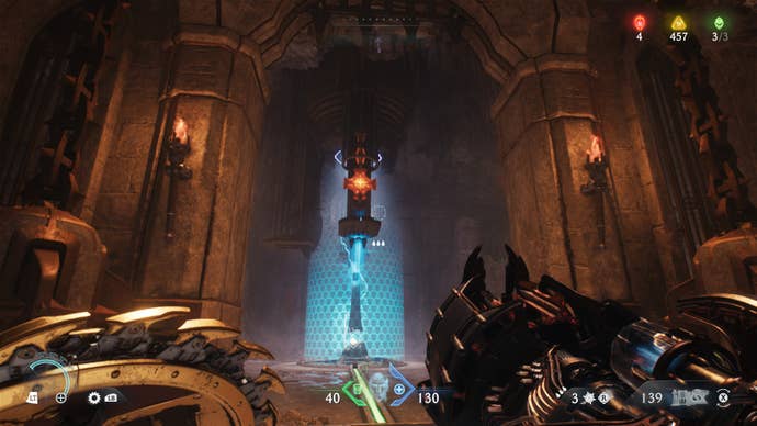 The player looks towards a weapon covered in a forcefield in The Siege Part 1 chapter of DOOM: The Dark Ages; Hot Metal can be seen above it