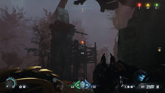 The player aims at some Hot Metal hanging from a large pillar in DOOM: The Dark Ages' Abyssal Forest