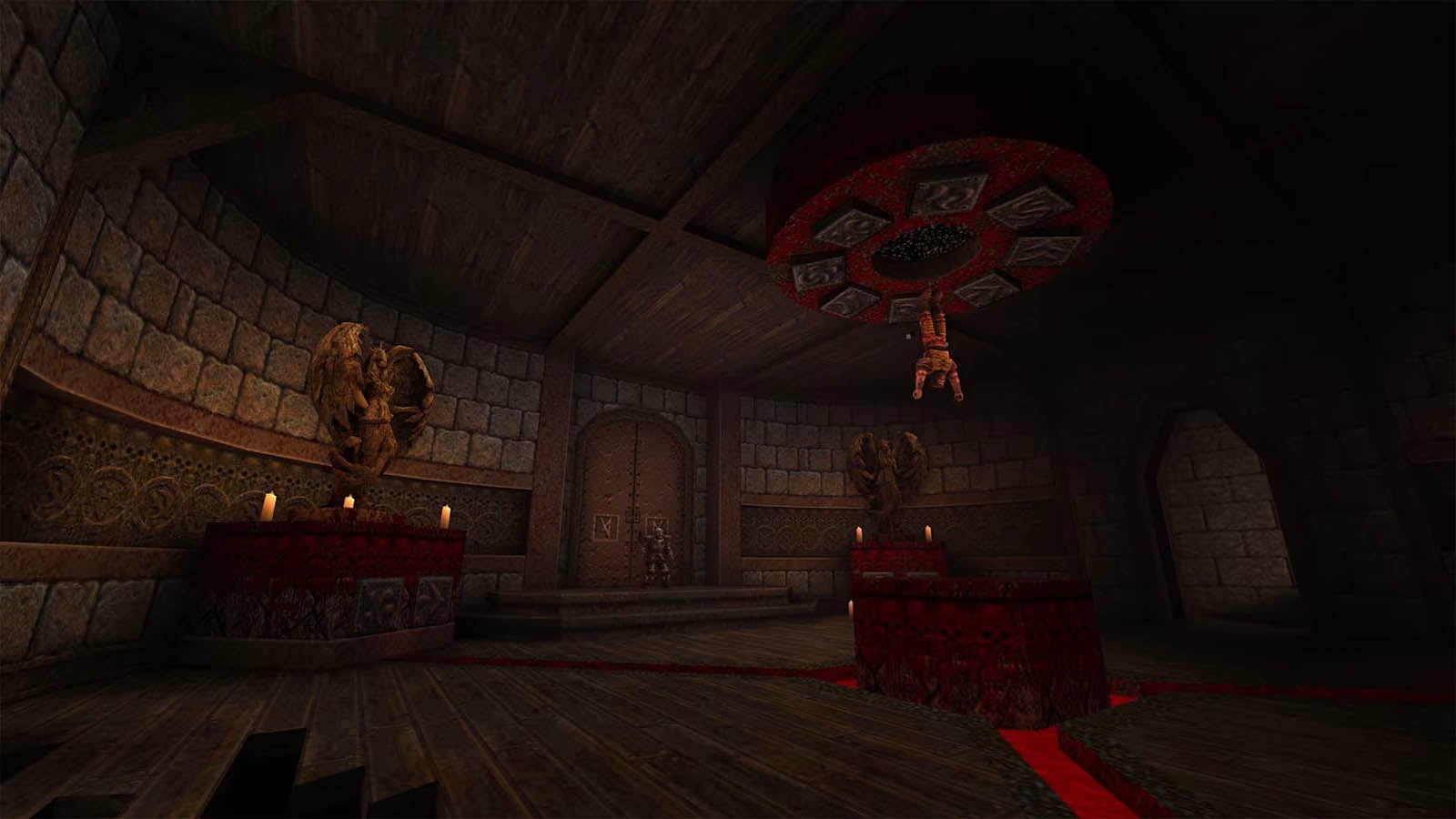 A character hangs upside down from a ceiling in a large chamber.