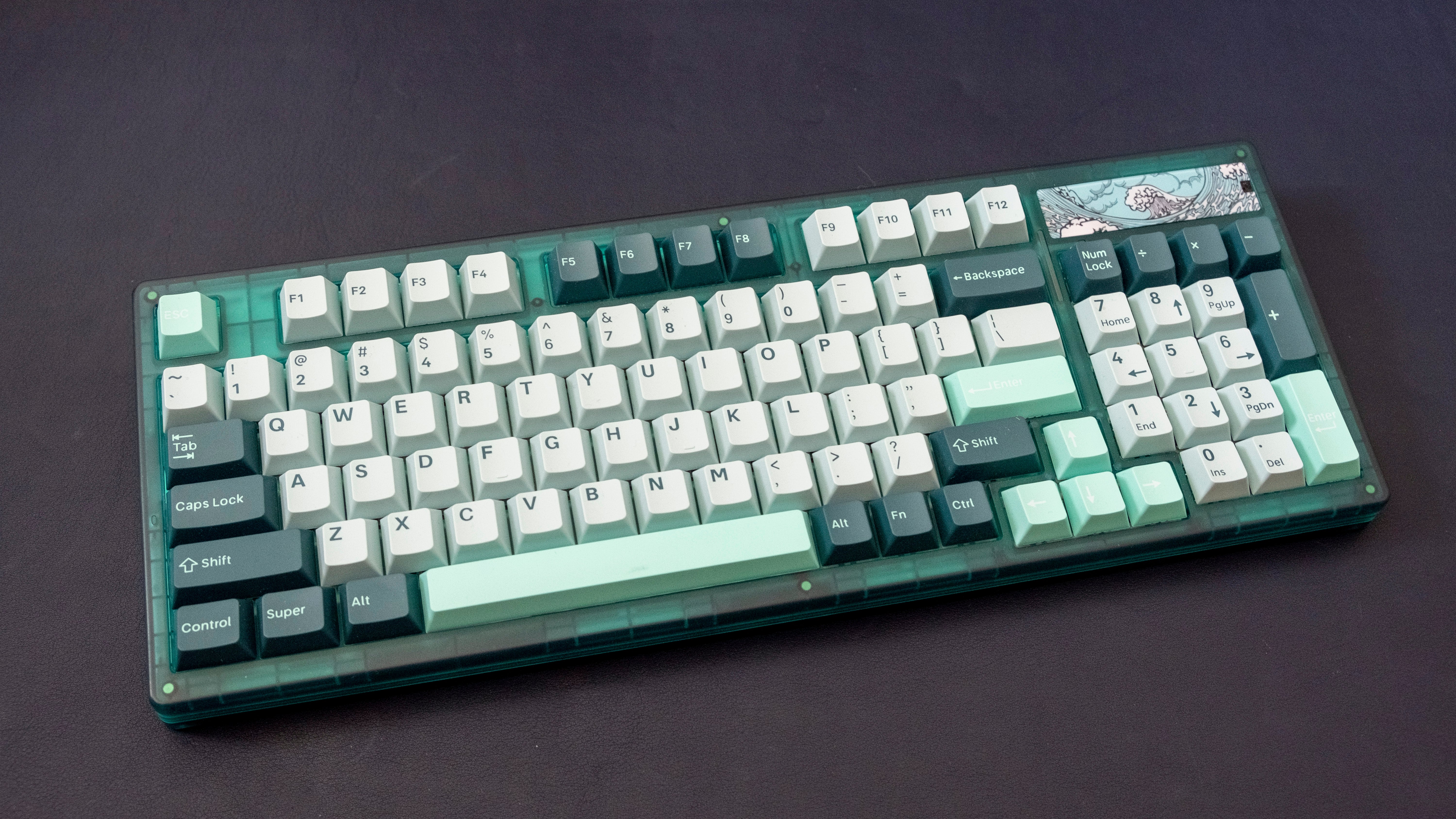 a Yunzii Keynovo IF98 mechanical keyboard, with a green layout and sea motifs