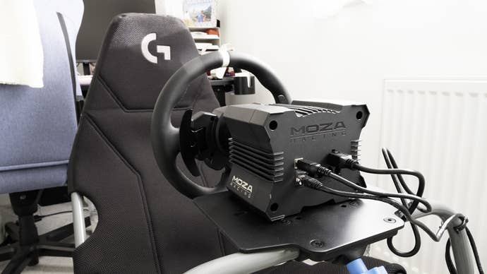 moza r5 bundle mounted on a playseat challenge x logitech g edition folding racing cockpit, viewed from the rear