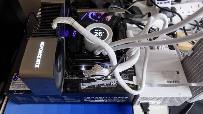a tangled twist of wires purporting to be a "intel core 285k test rig" based around the msi meg z890 ace motherboard