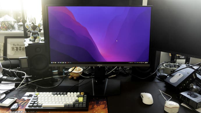 msi 272urx monitor screen on a messy desk