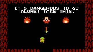 A man in a cave tells Link “It’s dangerous to go alone! Take this” and offers a sword. The man’s in red and has flames on either side of him. Link is in Green and the cave is completely dark.