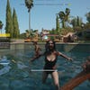The player fights zombies in the pool of a mansion in Bel-Air, in Dead Island 2