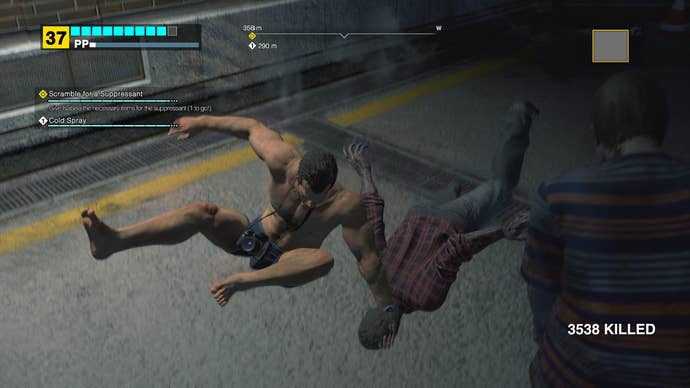 A shirtless Frank wrestles a zombie onto the floor in a screenshot from Dead Rising Deluxe Remaster.