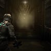 Isaac enters a forebodingly long, seeming empty hallway in Dead Space.