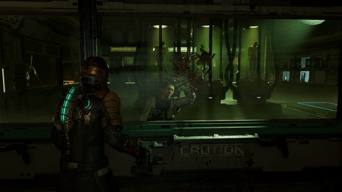 A Lurker necromorph kills an unfortunate scientist in the Dead Space remake.