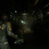 Isaac enters a forebodingly long, seeming empty hallway in the Dead Space remake.