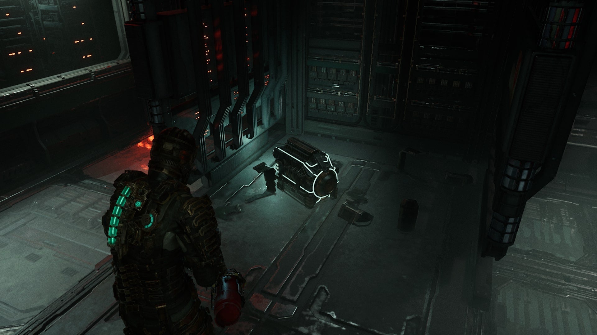 Isaac picks up a power cell in Dead Space - 3