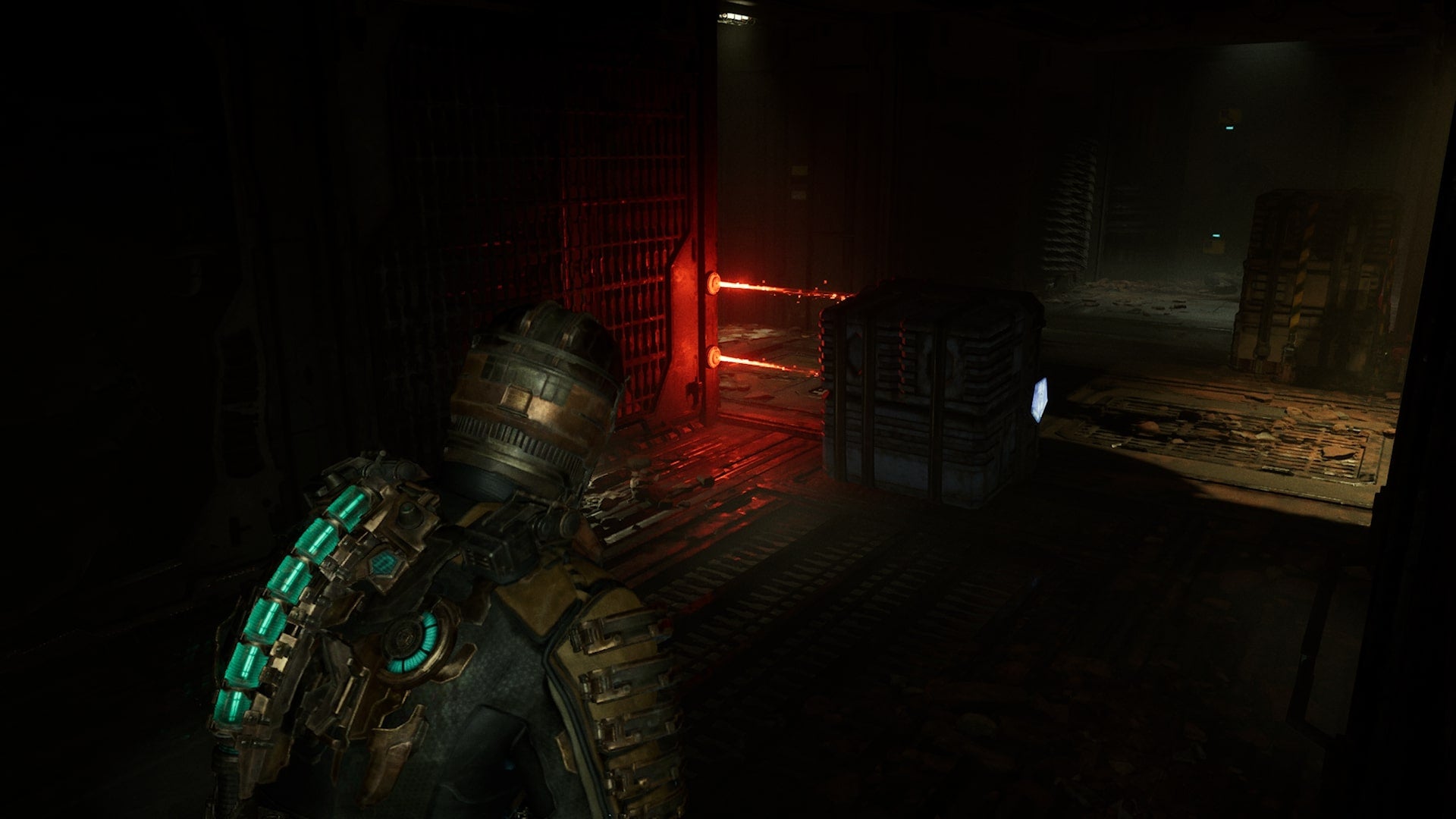 Isaac moves a crate using Kinesis to get past a laser trap in Dead Space