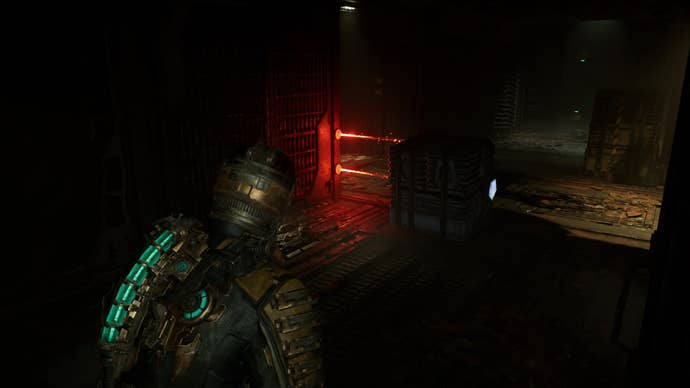 Isaac moves a crate using Kinesis to get past a laser trap in Dead Space