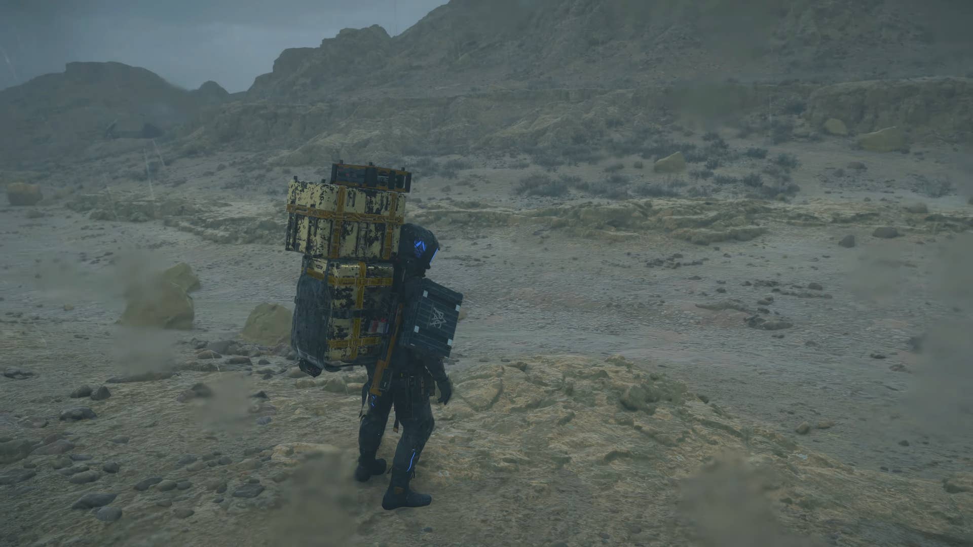 death stranding 2 screenshot - a dry riverbed and rainfall