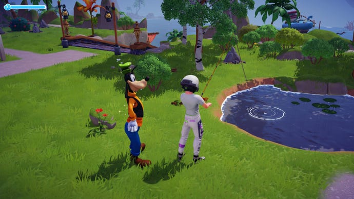Disney Dreamlight Valley screenshot showing the player fishing in a small pond in a grassy meadow, while Goofy stands and watches.
