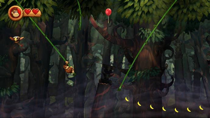 Donkey Kong swings between ropes in Donkey Kong Country Returns