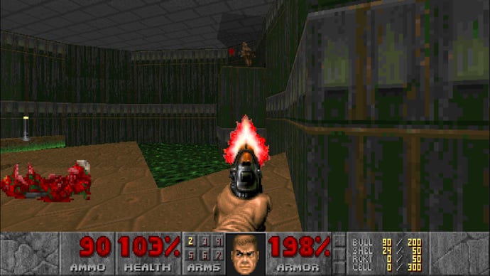The player shoots an imp on a high ledge in Doom 1993