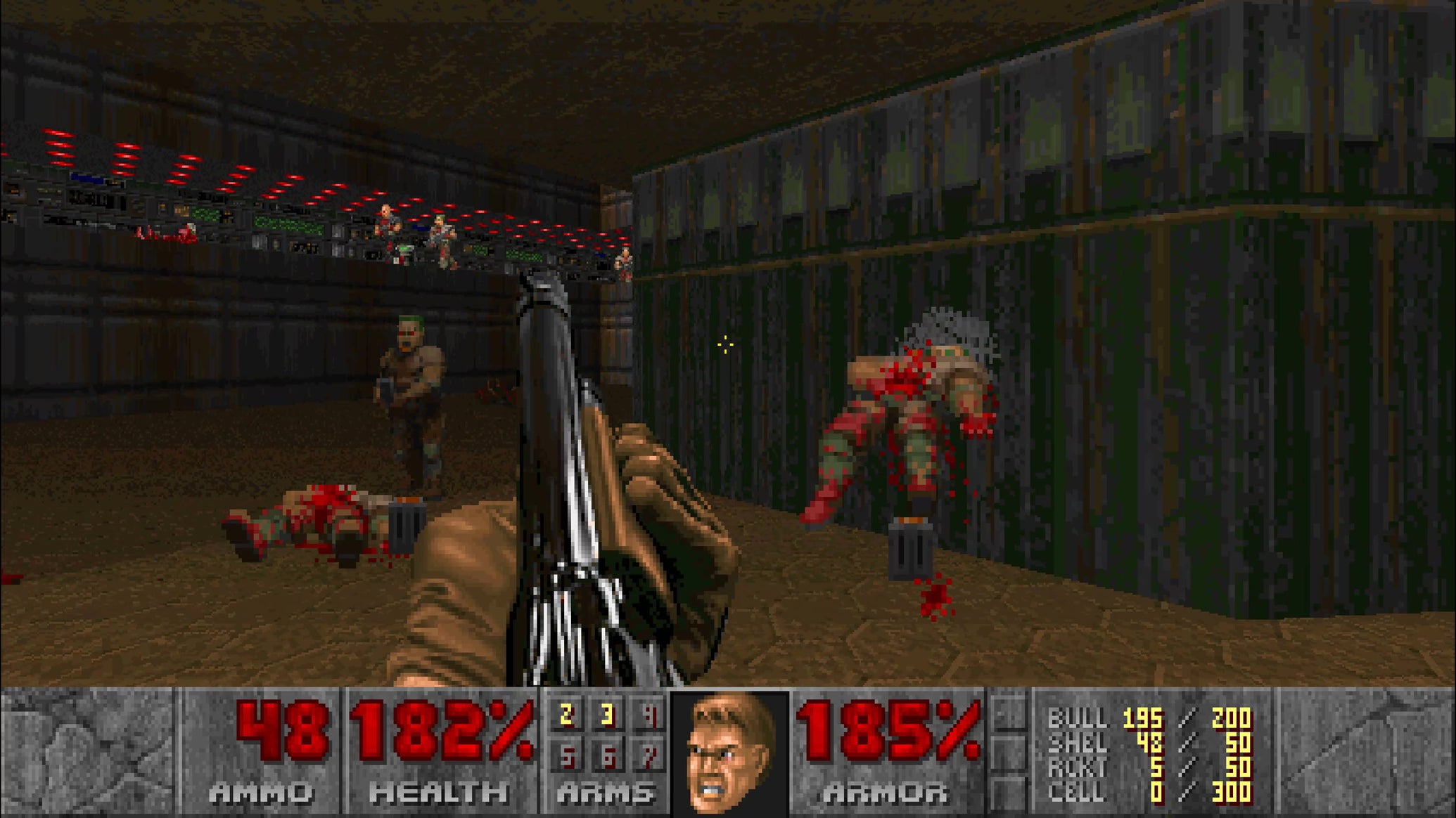The player fires a shotgun at two zombiemen in Doom (1993) - 1
