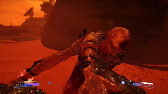 A zombieman is slapped with his own arm in Doom 2016
