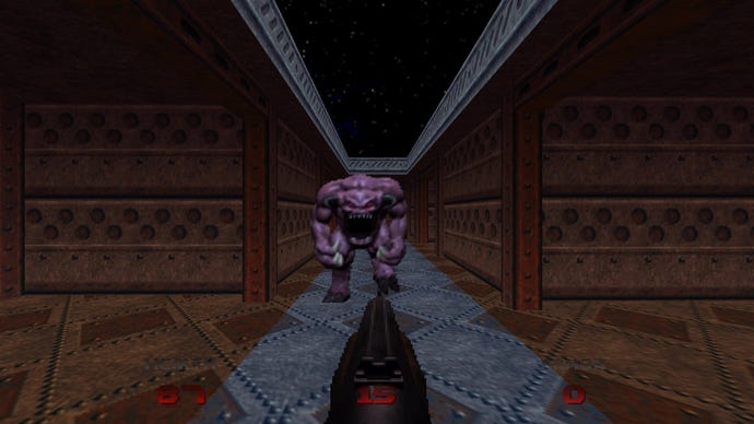 A pinky comes at you down a corridor in Doom 64