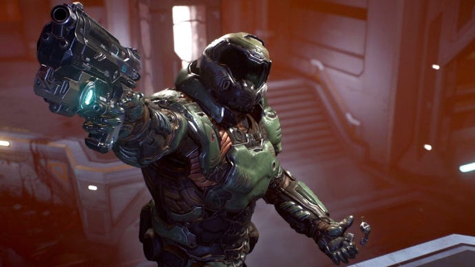 A screenshot from the finale of DOOM 2016, showing Doomguy triumphantly pointing his gun at the camera as if to say, "Chew on this, FOV value below 90!"