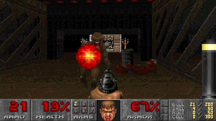 A screenshot from DOOM showing some gunplay against an Imp. Doomguy's face is bloodied and battered, as is my head after having endured nauseau to capture this screenshot.