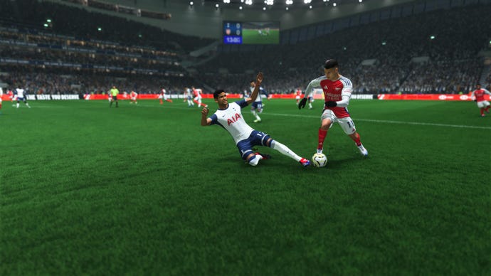 Cristian Romero dispossessing Gabriel Martinelli with a slide tackle in EA Sports FC 25.