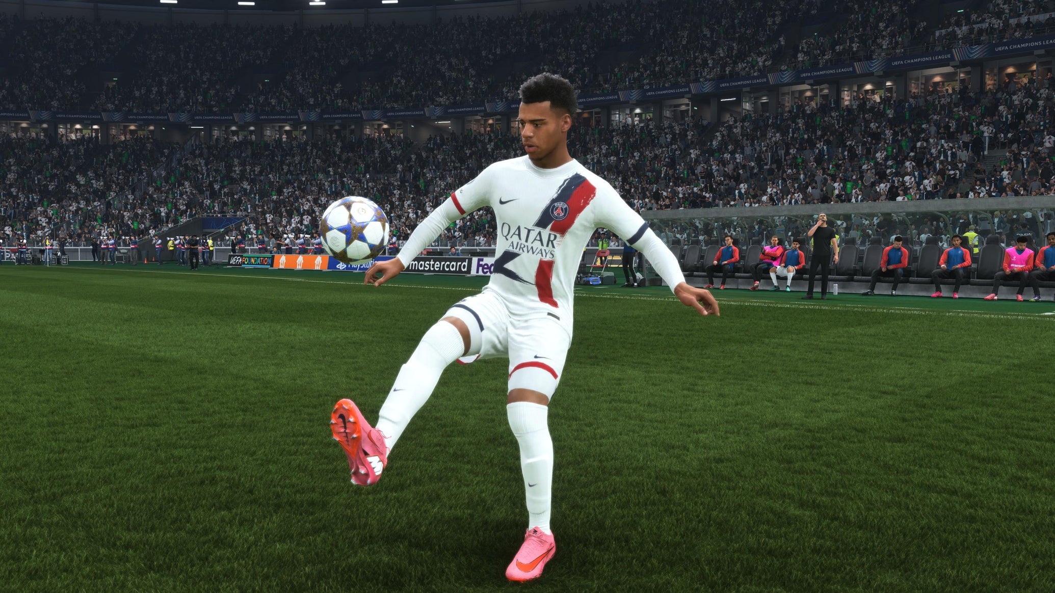 Desire Doue, one of the best young players in EA Sports FC 26, controlling the ball in the middle of the pitch. - 1