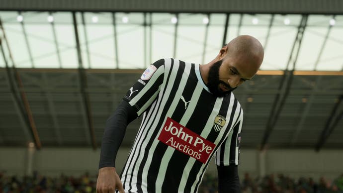 EA Sports FC 24 screenshot, showing a closeup shot of David McGoldrick, a Notts County player looking pensively downwards.