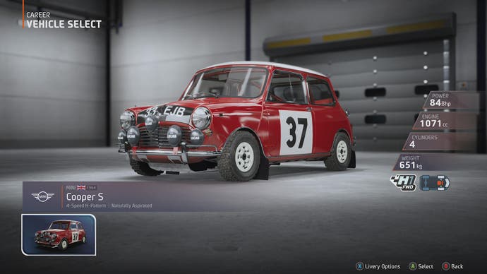 EA Sports WRC review 5: A shot of a bright-red Mini Cooper S, in all its brisk glory, in a garage.
