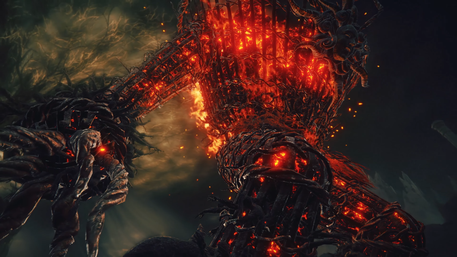 Towering flaming giant with cage-like body on fire against dark sky