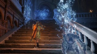 A warrior ascends a staircase inside the Carian Study Hall in Elden Ring.
